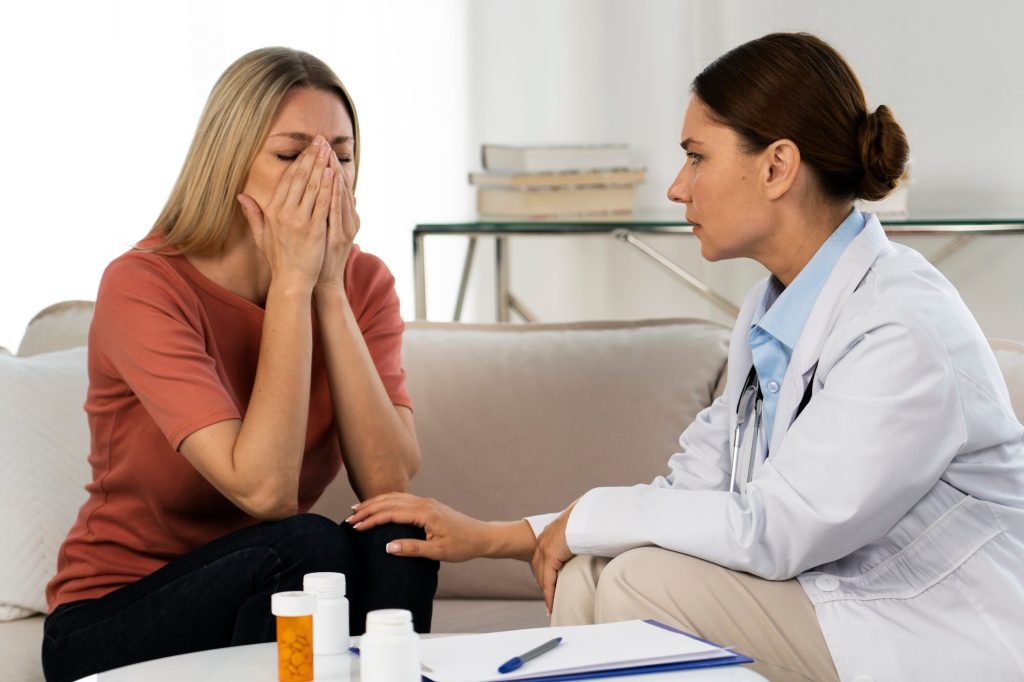 Woman being given upsetting news in hospital